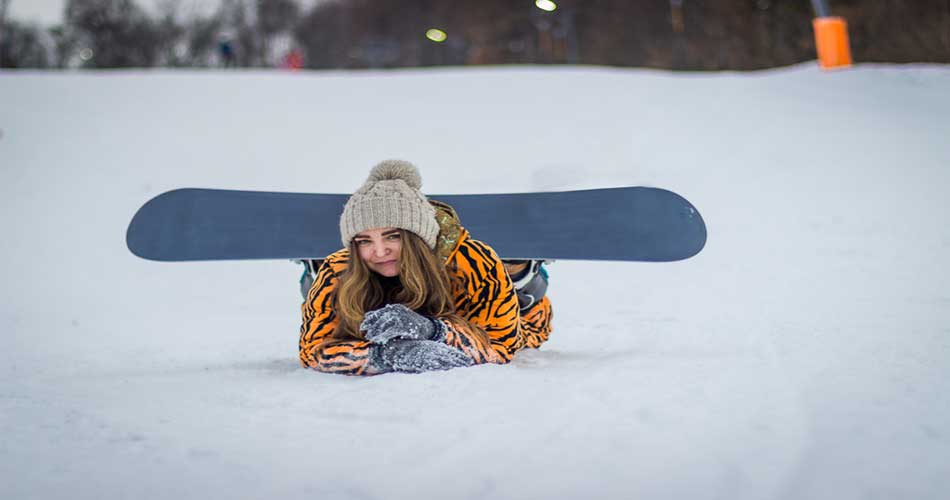 Female snowboarder at Pat's Peak Ski Area in NH.