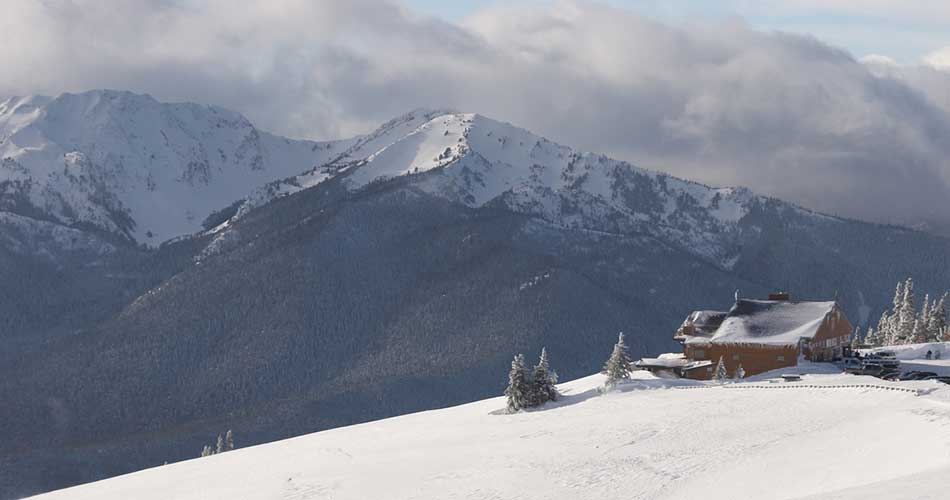 Lodge and mountains at Hurricane Ridge Ski Area.