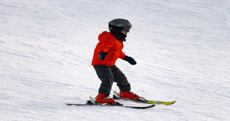 Kid skiing at Mount Sunapee Resort.