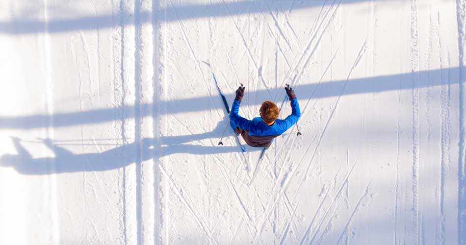 Nordic skier on trails at Trollhaugen Outdoor Recreation Area.