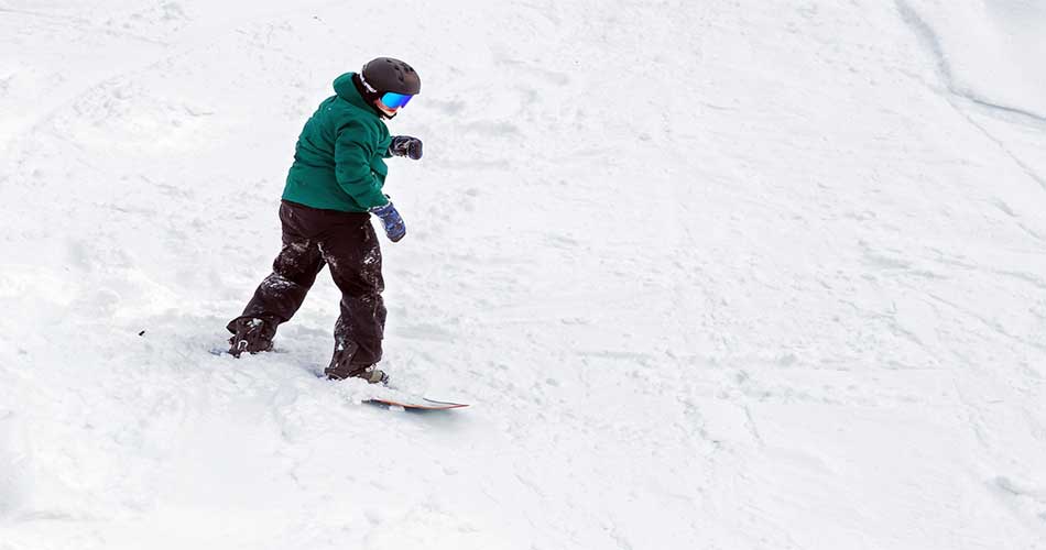 Snowboarder on trails of Black Mountain of Maine