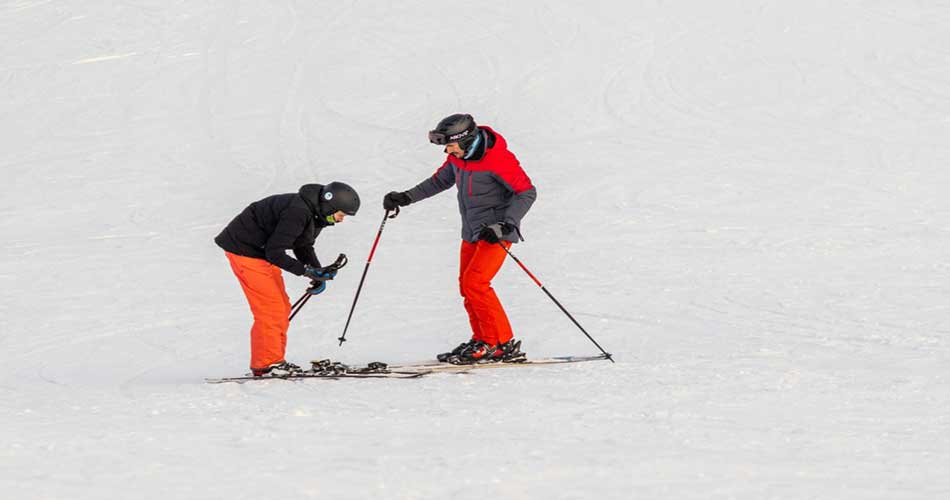 Skiers checking skis at Afton Alps.