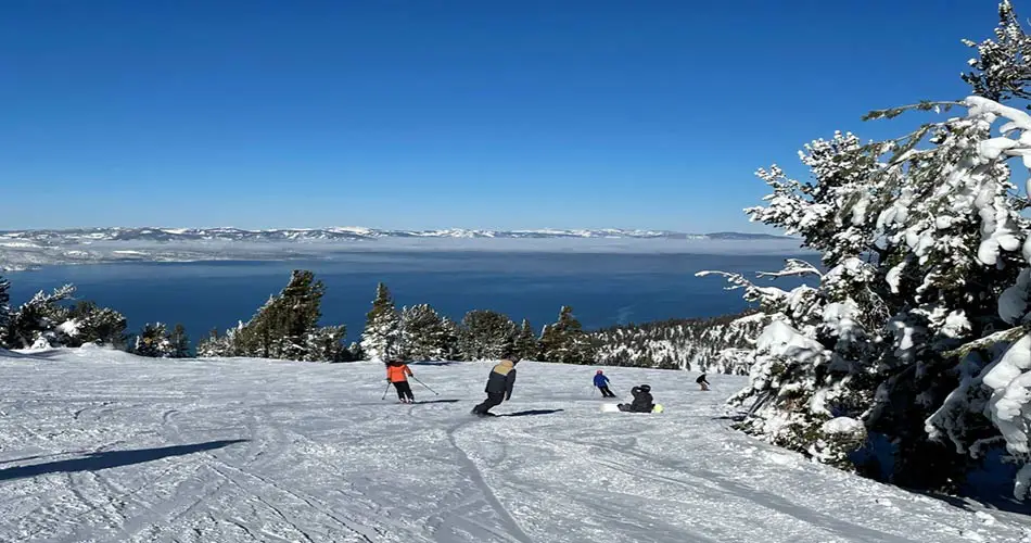 Heavenly Ski Resort snowboarders and skiers on trails.