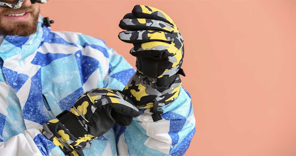 Snowboarder wearing snowboard gloves with wrist guards.