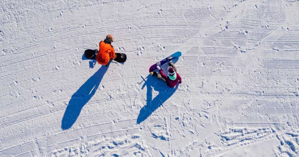 Snowboarders enjoying the trails at Peek'n Peak Resort in NY.