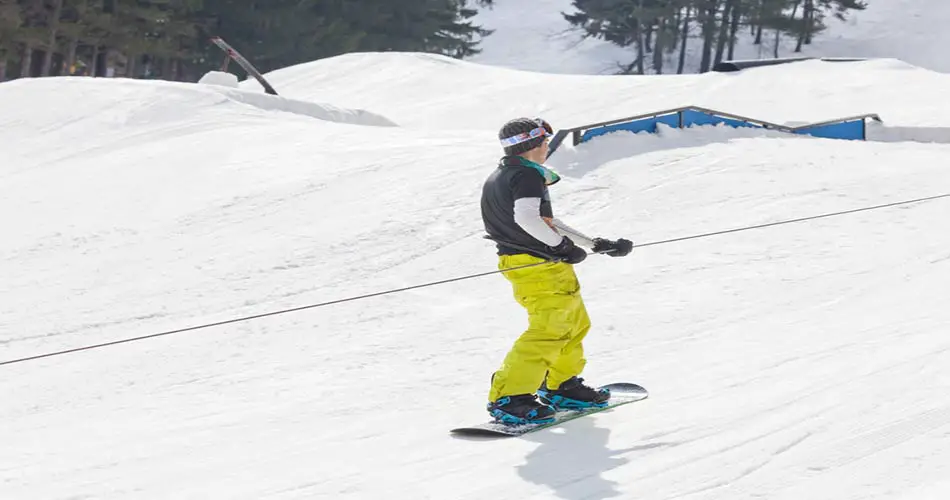 Snowboarder on tow rope at Wisp Ski Resort.