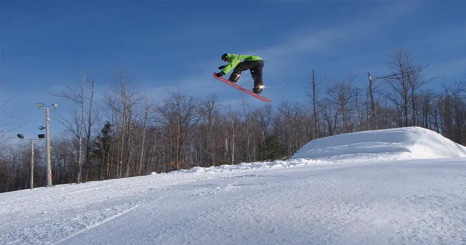 Snowboarder on jump at Indianhead terrain park.