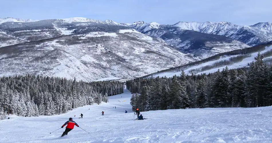 College skiers on trails at Vail ski resort.