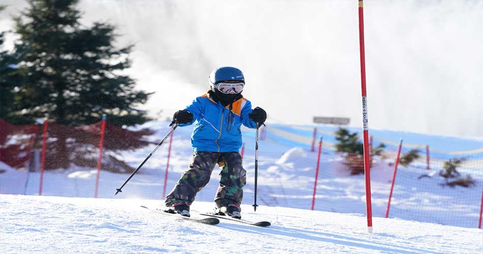 Child learning to ski