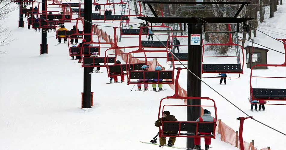 Crowds at ski bradford, MA, on ski lifts.