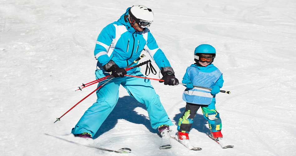 Dad teaching daughter at Ski Brule in Michigan.