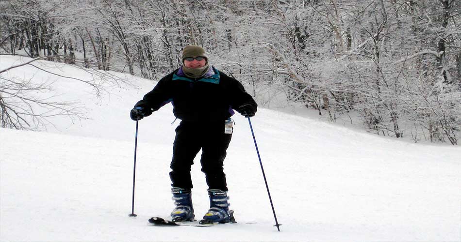 Happy skier on trails at Mount Snow in VT.