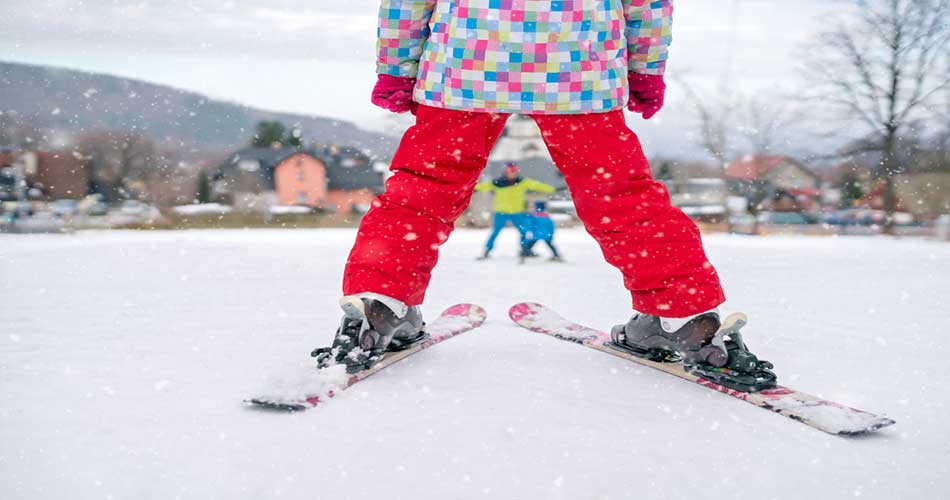 Child practicing pizza skiing technique