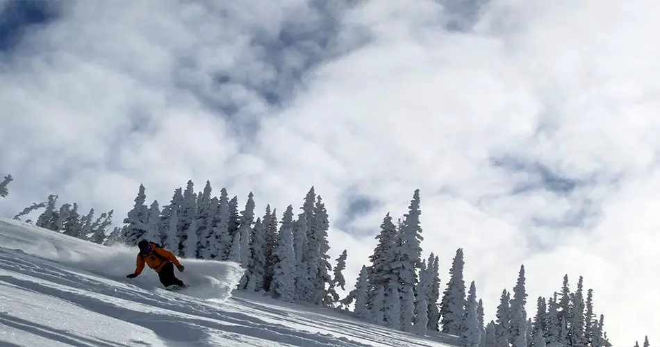 Snowboarder on mountain.