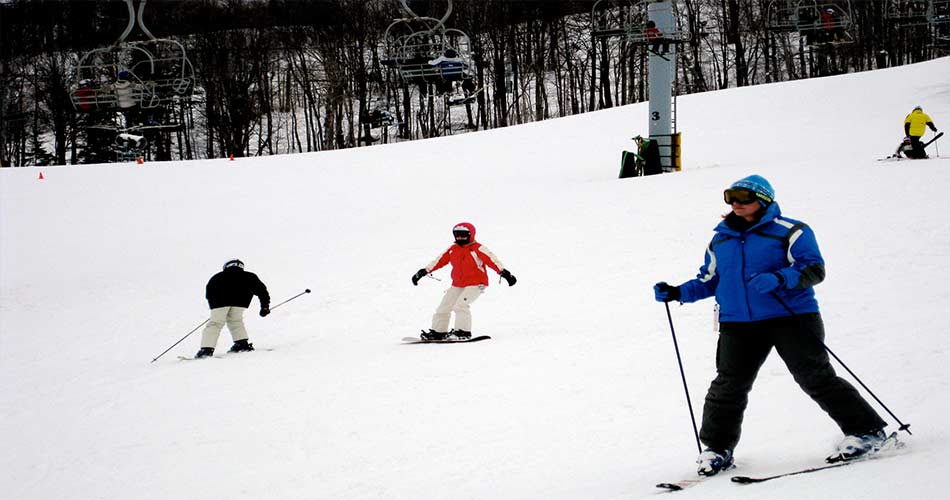 Skiers on trail at Mount Snow in Vermont