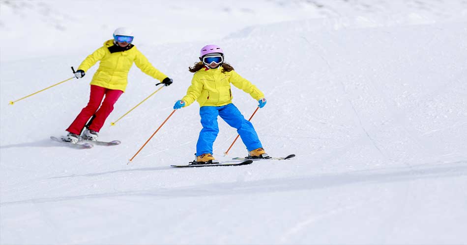 Two skiers skiing at Hidden Valley Ski Resort in PA.