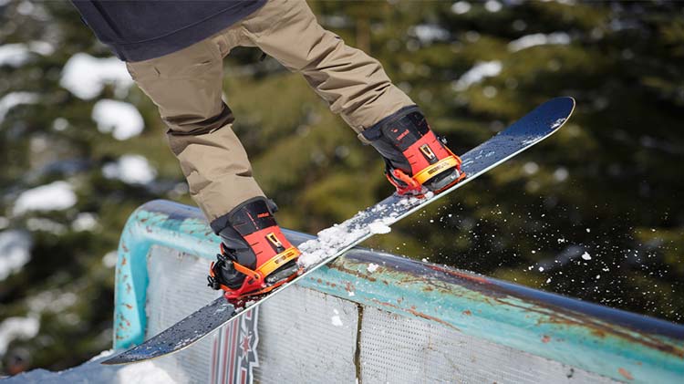 Riding rails with a Lib Tech snowboard.