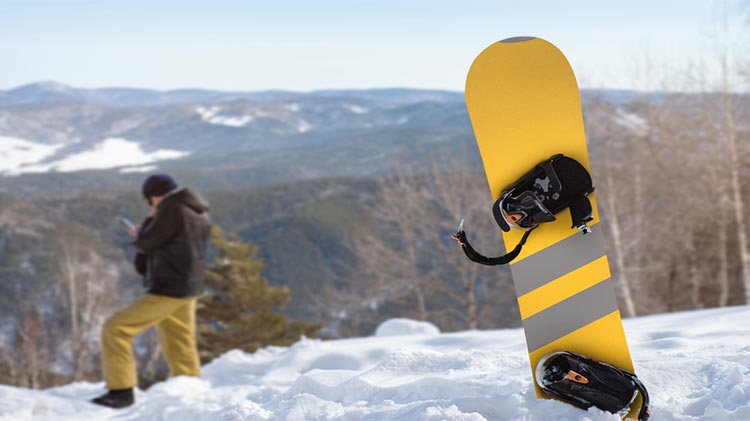 Wide snowboard on slopes
