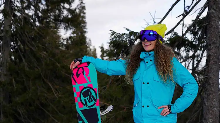 Lady holding snowboard