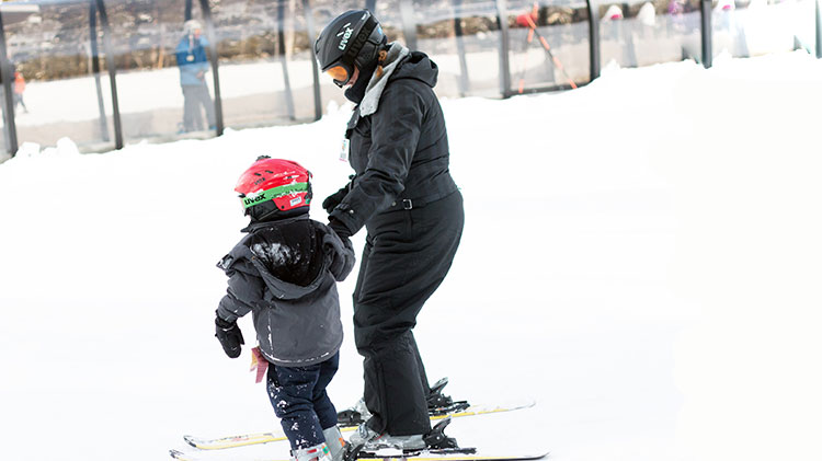 mother and child skiing