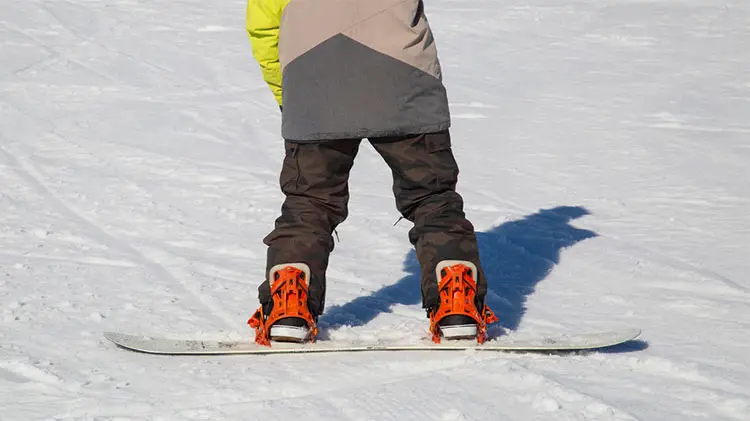 Riding a Rossignol snowboard.