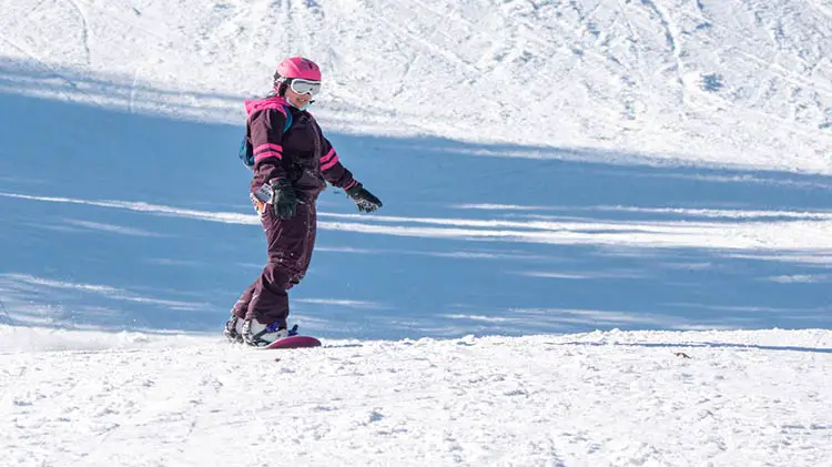 Snowboarder riding at Swain ski resort