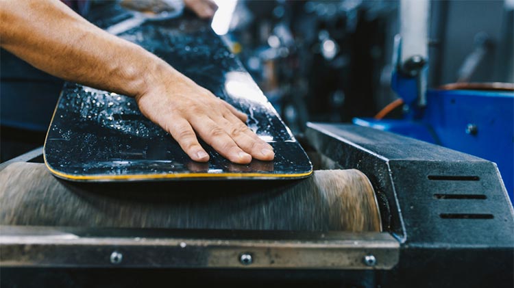 Waxing a snowboard base