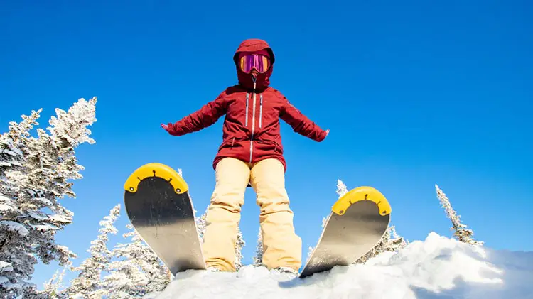 skier red jacket snow googles