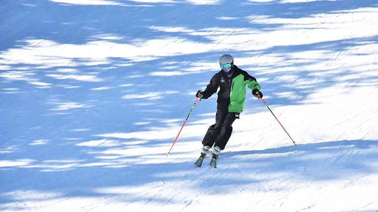 Downhill skiing in full gear
