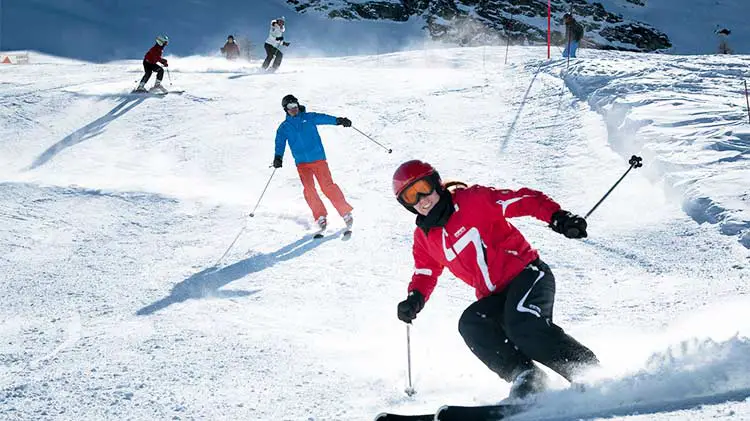 Family on ski vacation on slopes