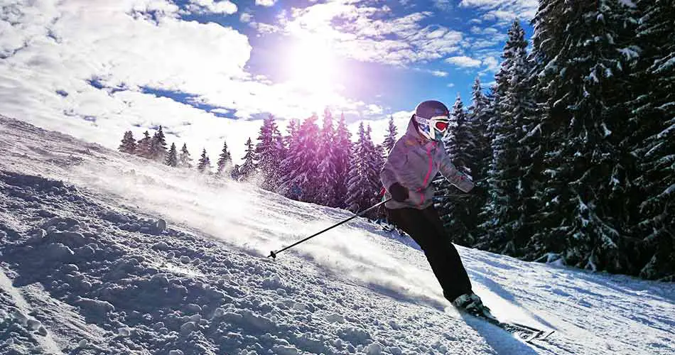 full gear girl skiing downhill